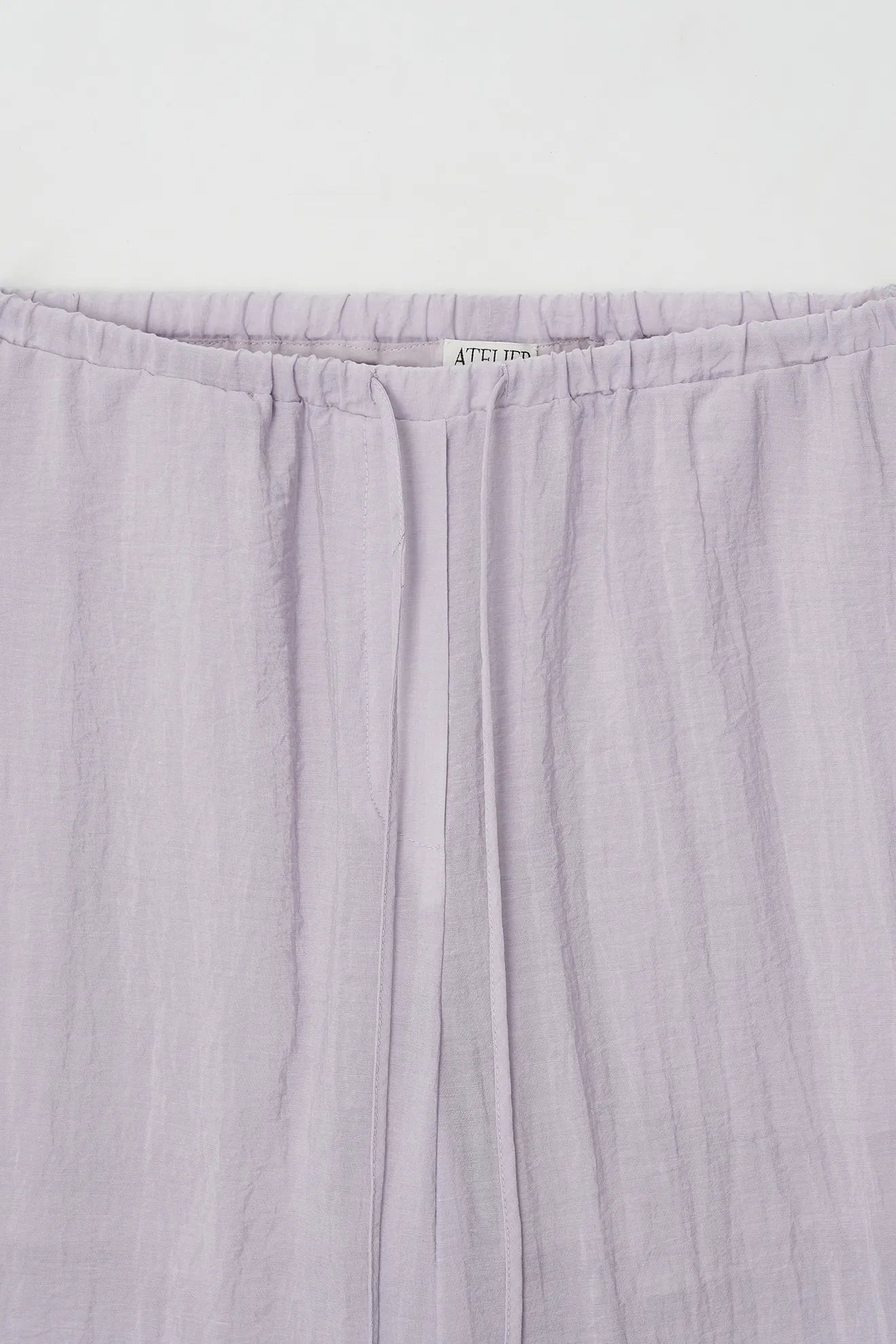 Elastic waistband detail of Sheer Lining Pants in Purple
