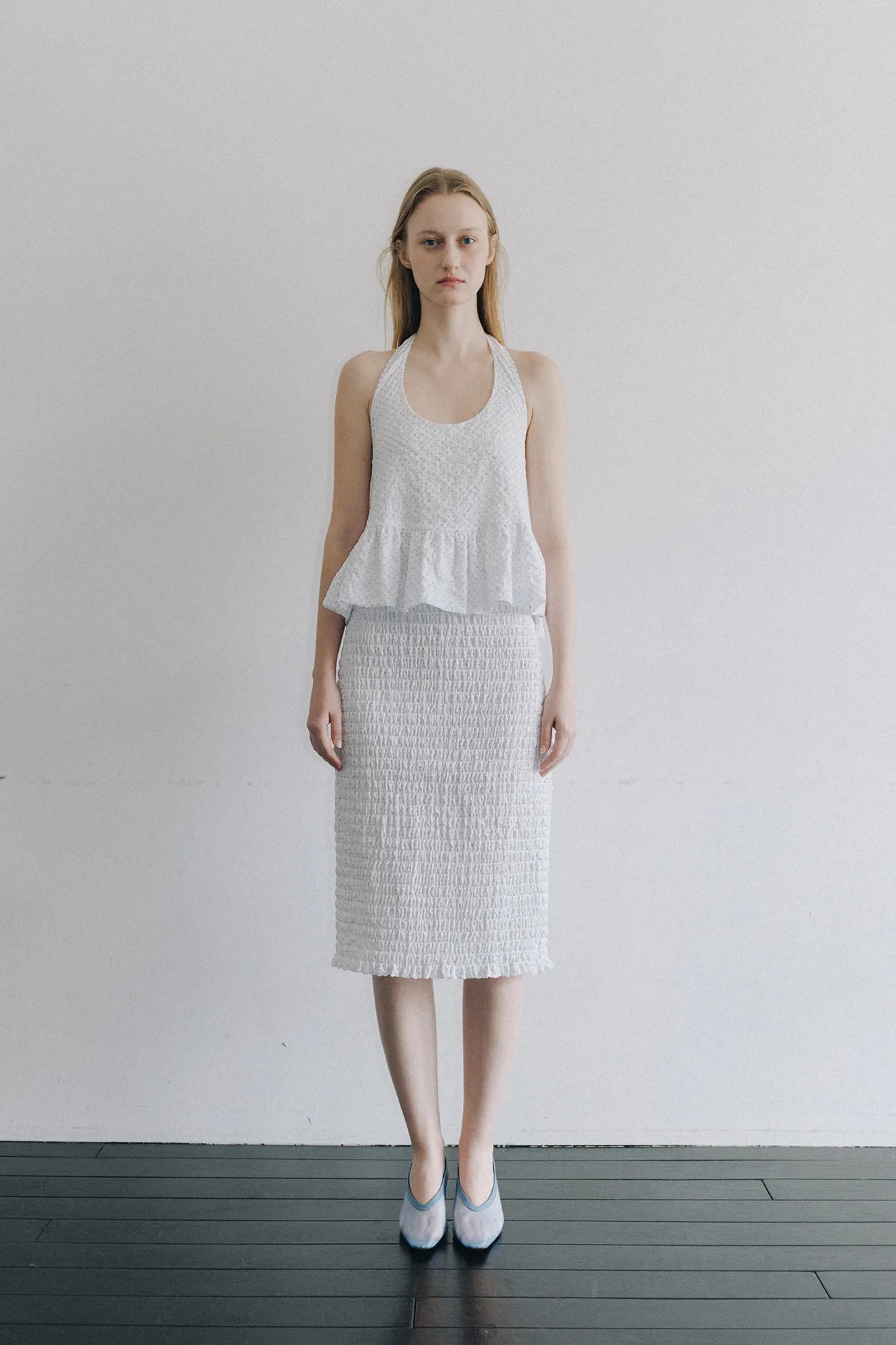 Model wearing Smocked Banding Skirt in White