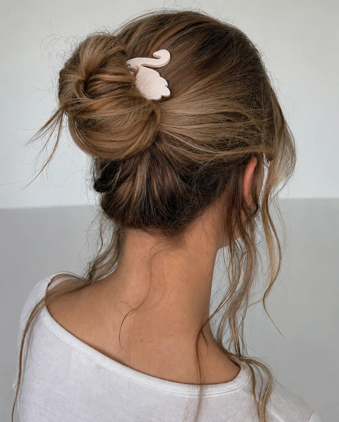 Model wearing Turtle Story Swan Fork in Merengue