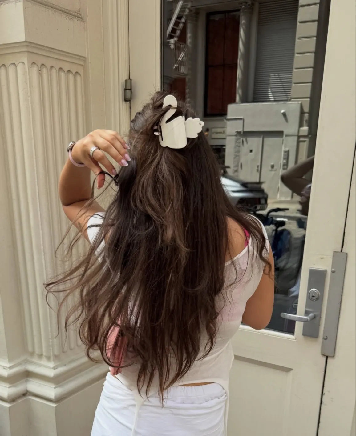 Model wearing Turtle Story Swan Knot in Off White
