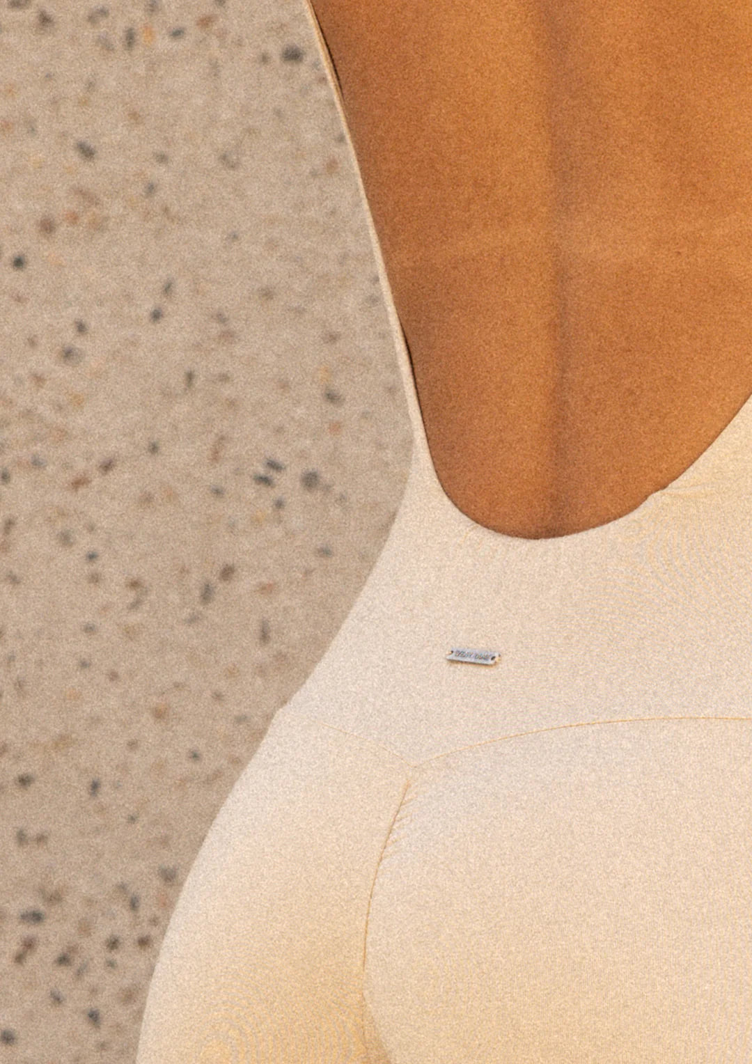 Fabric detail of Wearrame Kamari Backless Onesie in Ivory