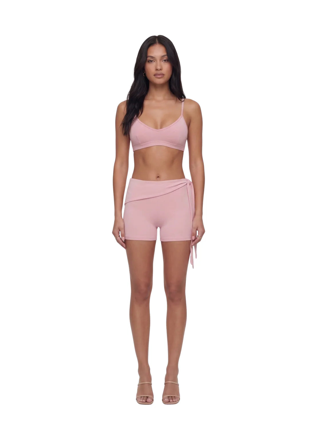 Female model wearing wearrame Tide Wrap Short Pants in Blush pink with matching sports bra