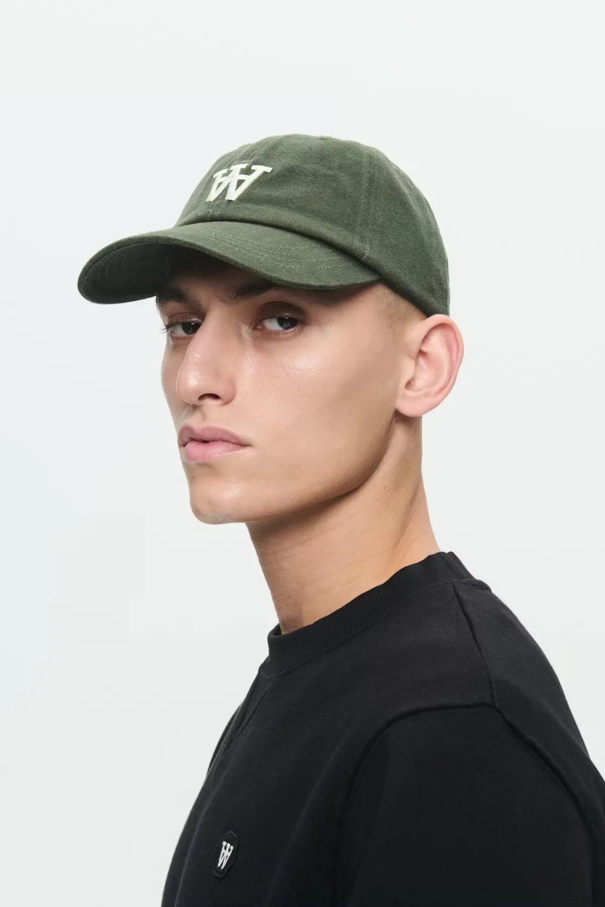 Wood Wood Eli Cap Grape Leaf Green worn by model