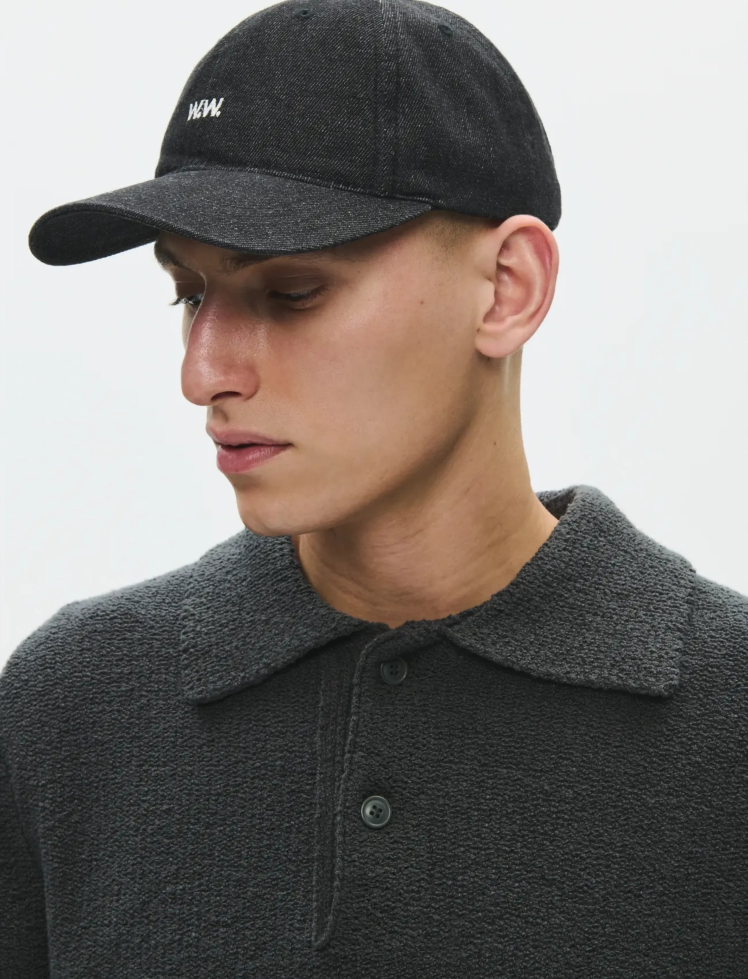Front view of model wearing Wood Wood W.W. Cap in Black Sand