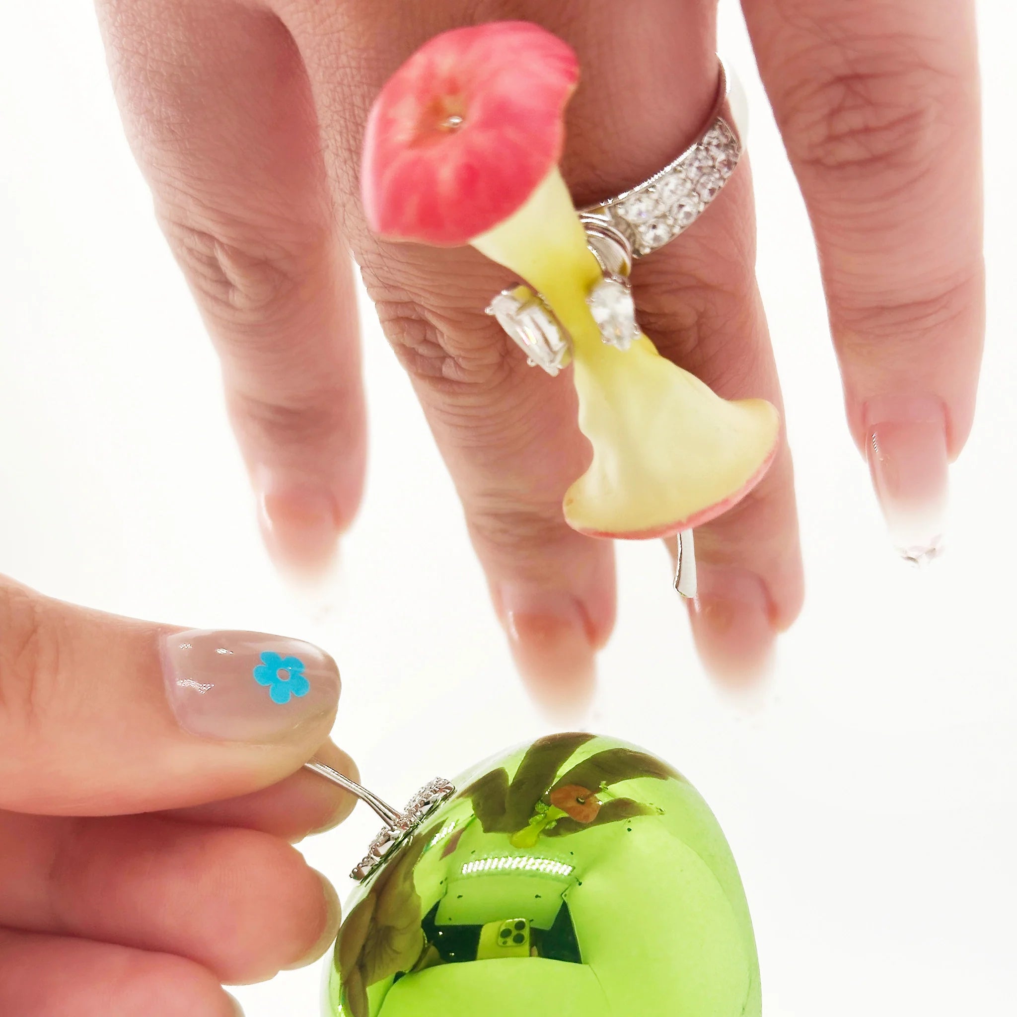 Close-up of YVMIN Paradise Apple Core Spin Ring Red