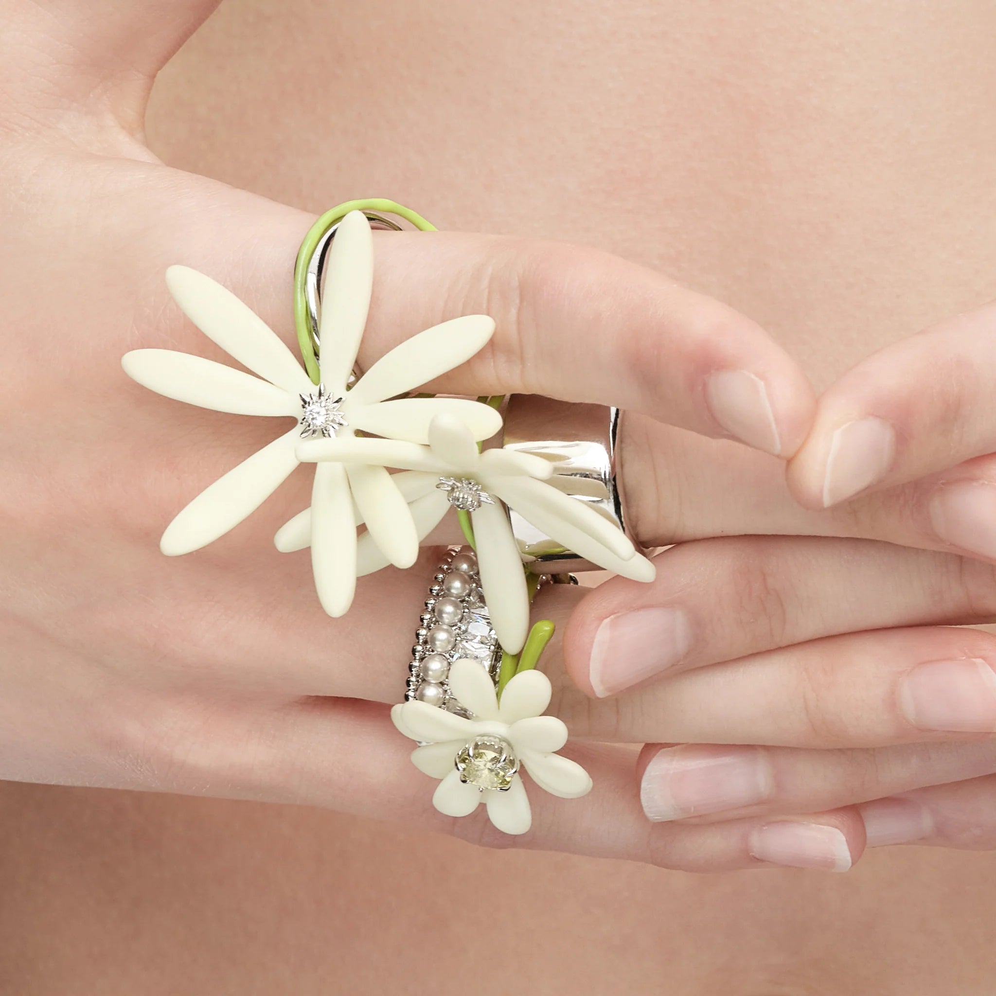 Close-up of YVMIN Paradise Daisy Gemstone Ring White on hand
