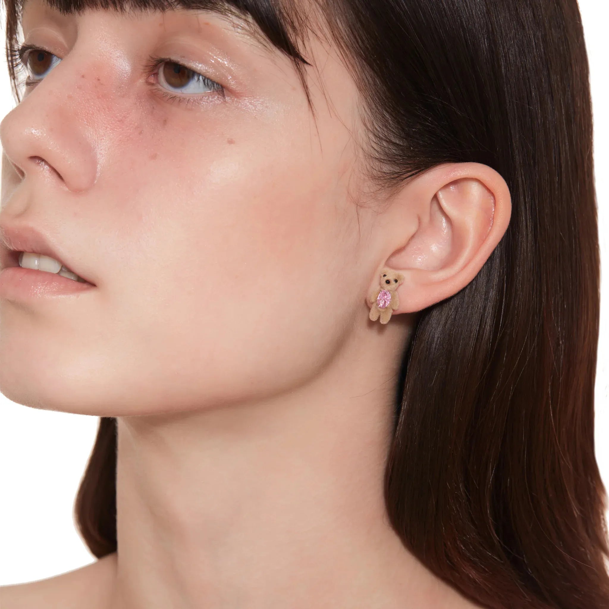 Model wearing YVMIN Paradise Flocked Mini Bear Earring Pink