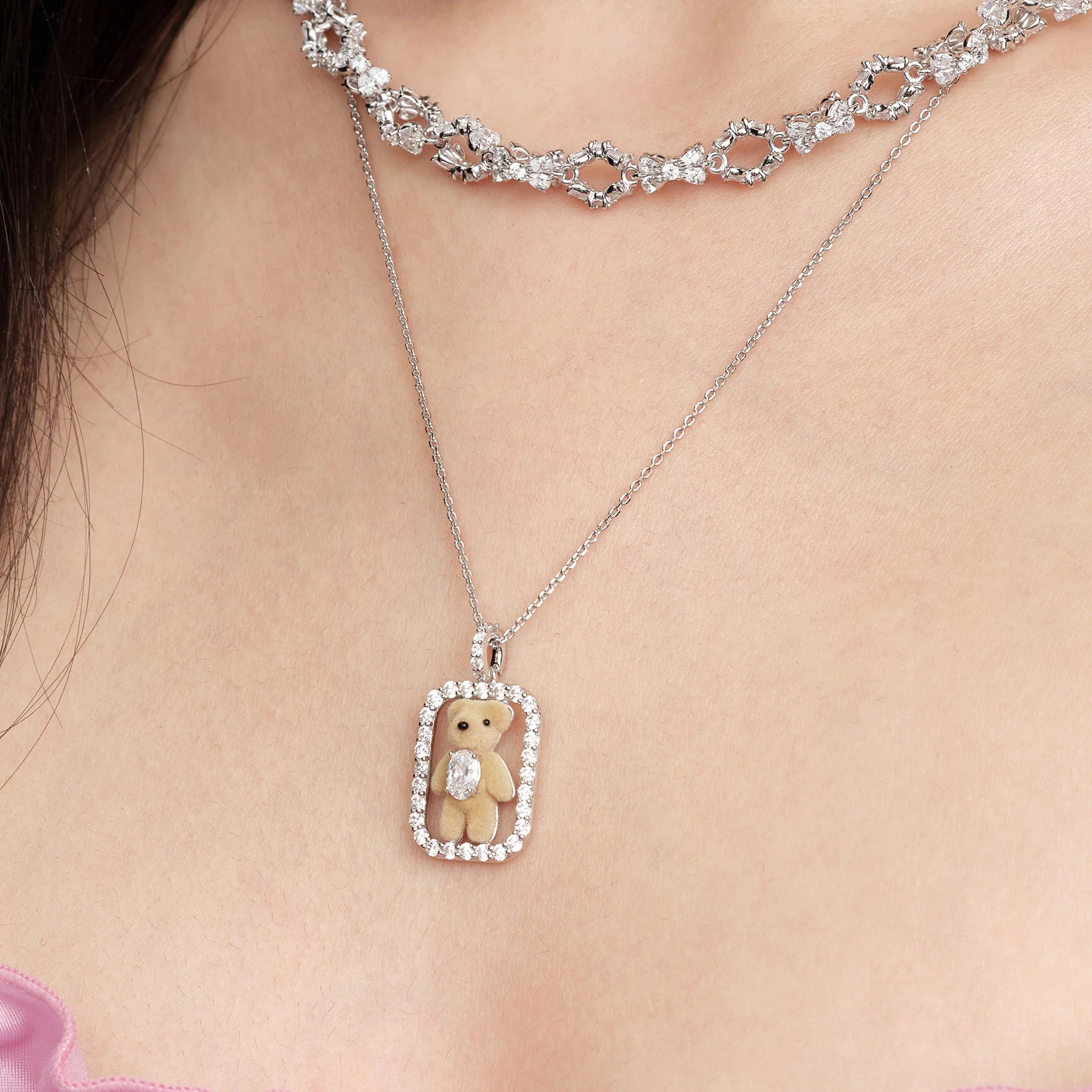 Close-up of model wearing YVMIN Paradise Inlaid Mini Bear Necklace in Silver