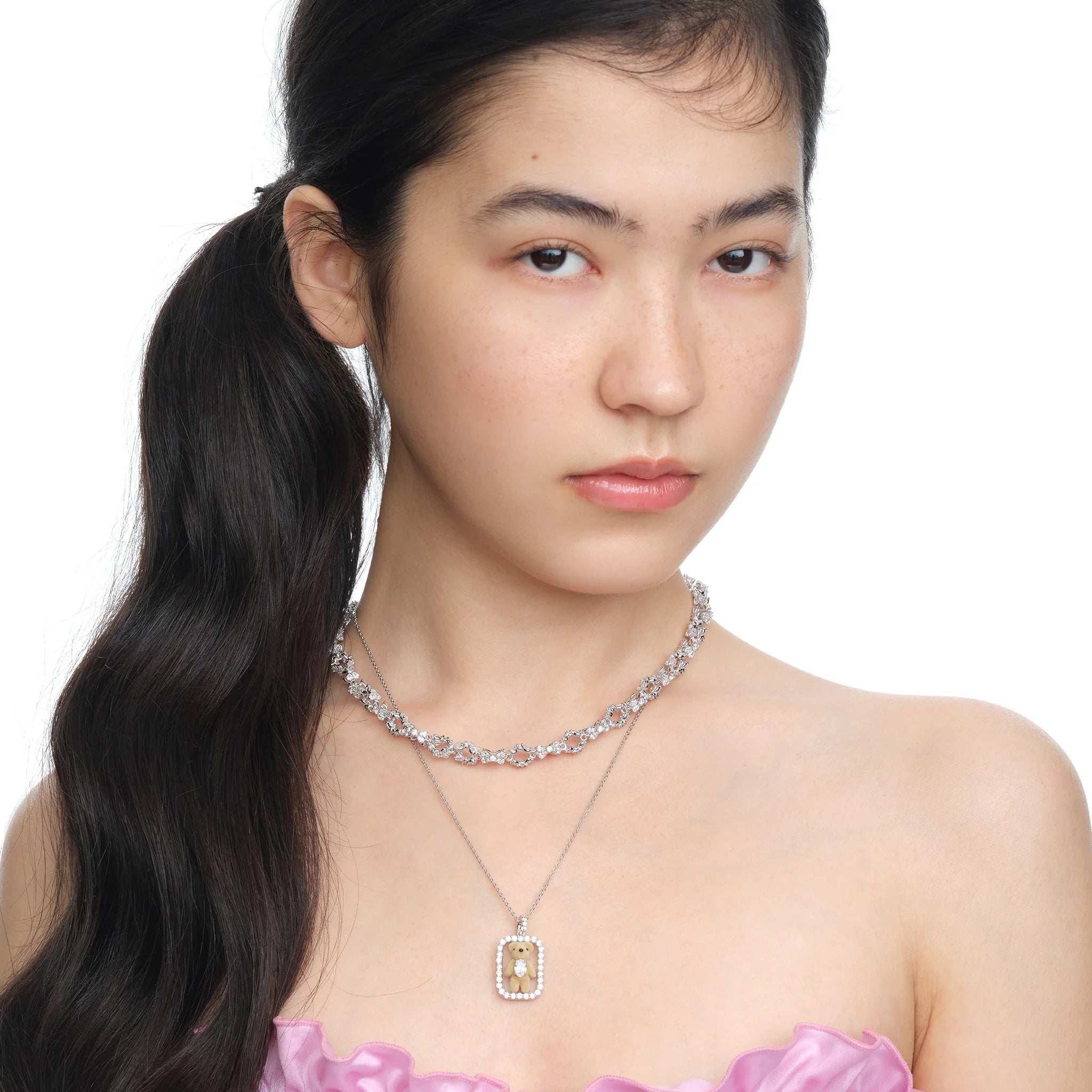 Model wearing YVMIN Paradise Inlaid Mini Bear Necklace in Silver
