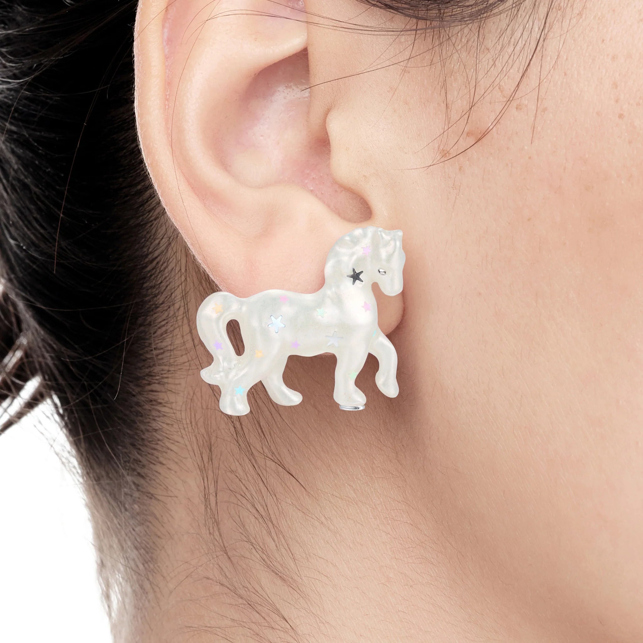 Close-up of YVMIN Paradise Pony Earrings in White