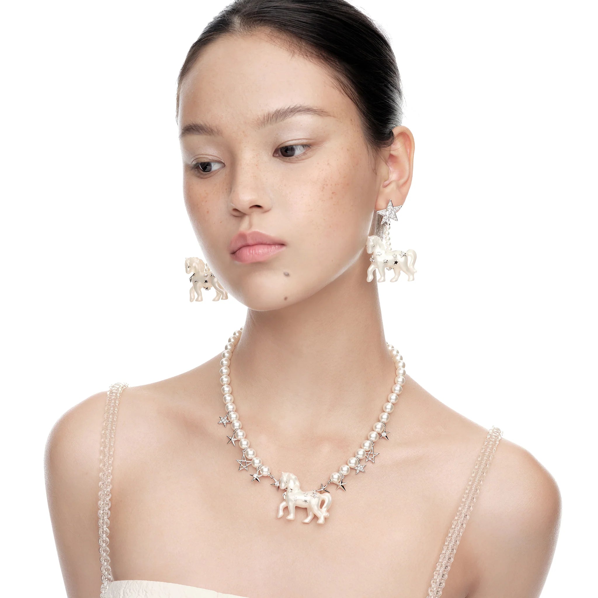 Model wearing YVMIN Paradise Pony Star Pearl Necklace