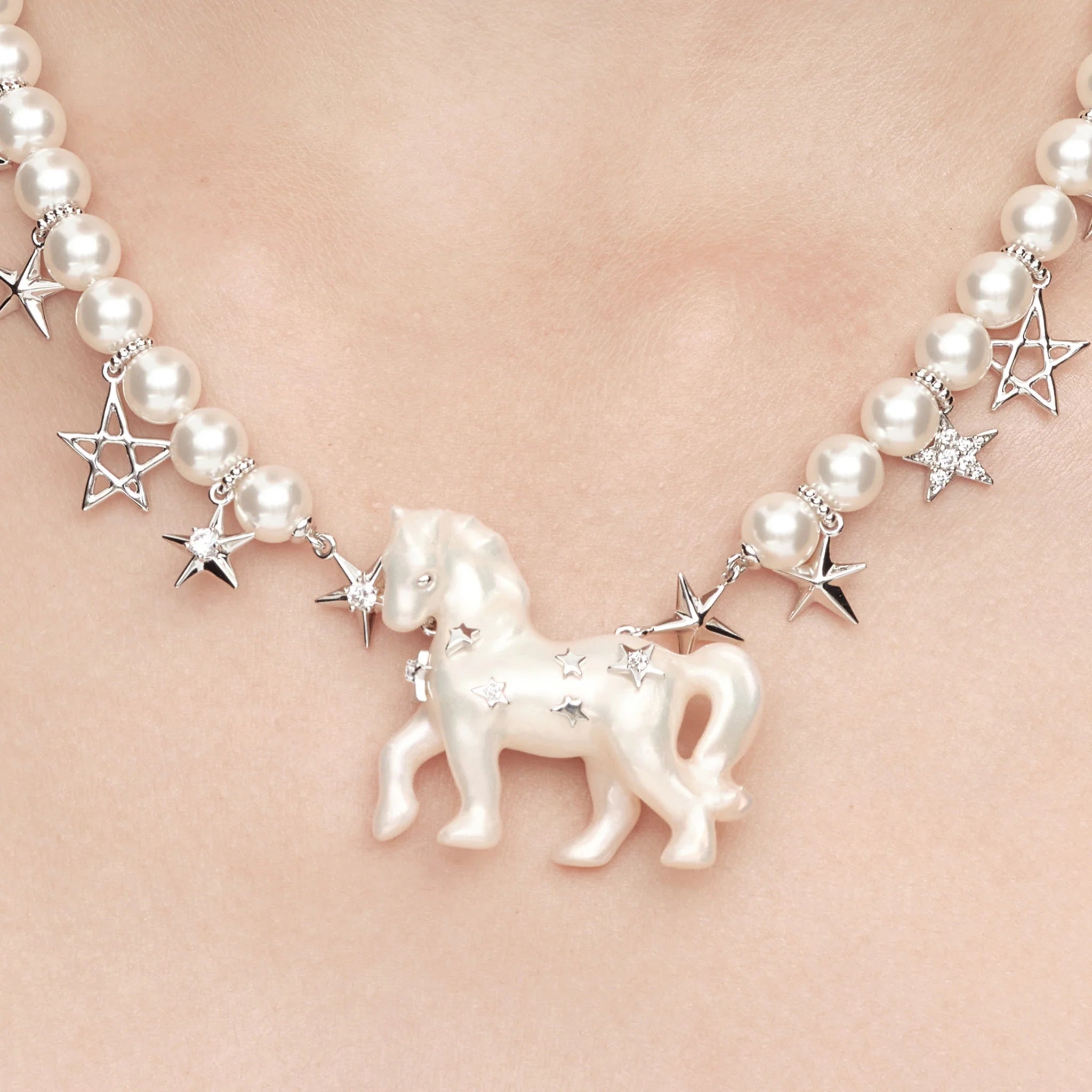 Close-up of YVMIN Paradise Pony Star Chain Pearl Necklace