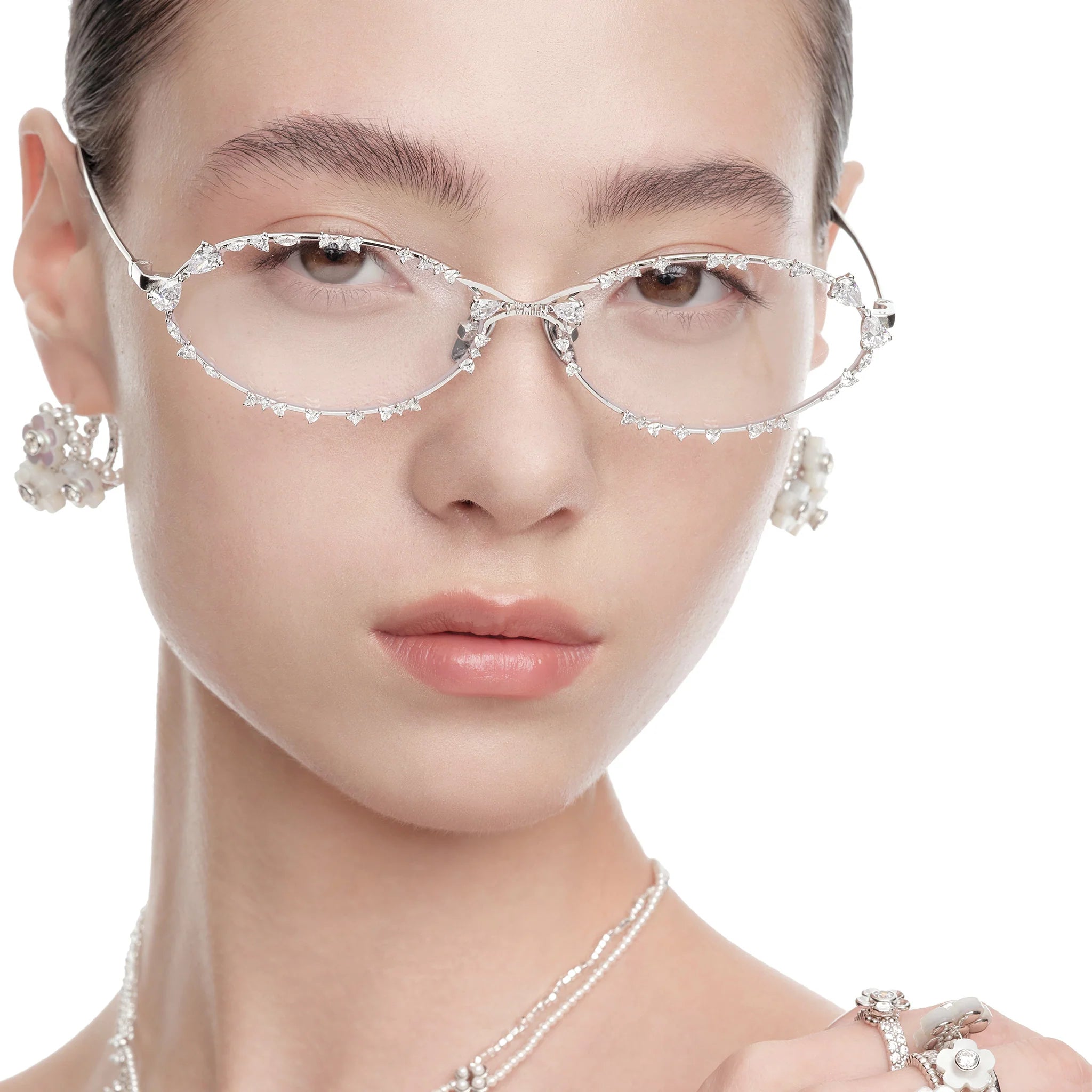 Close-up of model wearing YVMIN Ripple Bitter Salty Glaze Glasses